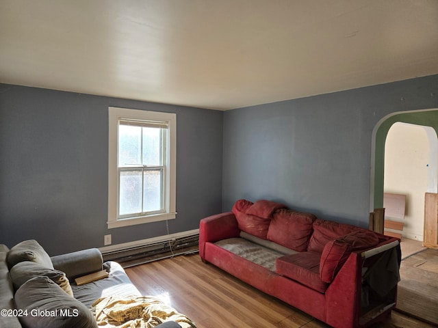 living room with a baseboard radiator and wood-type flooring