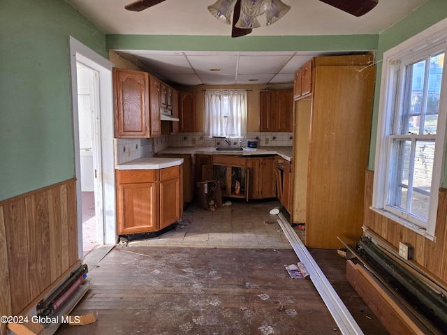 kitchen with plenty of natural light, decorative backsplash, and sink