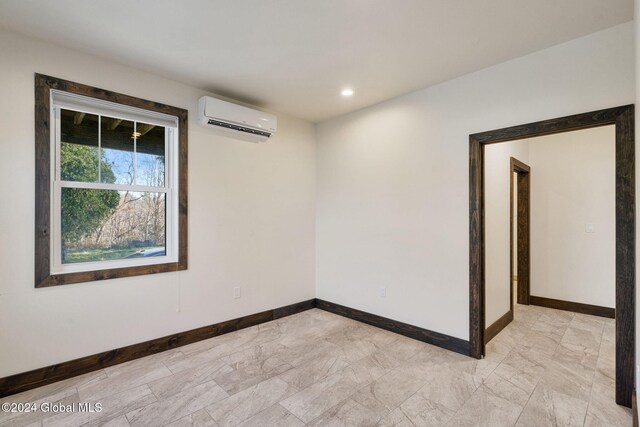 empty room featuring a wall mounted AC