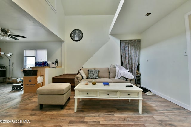 living room featuring ceiling fan and wood-type flooring