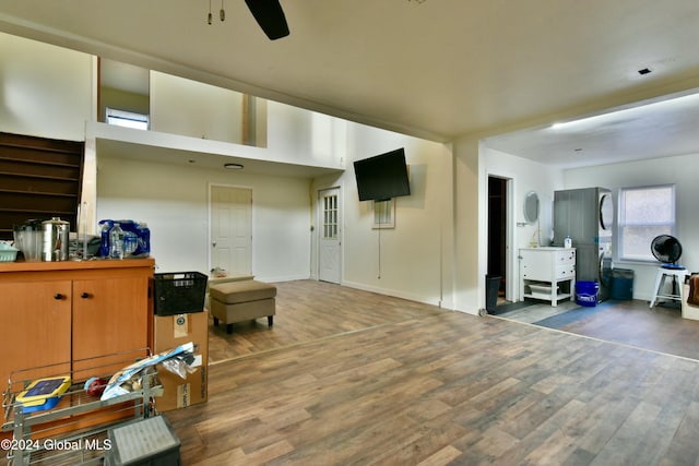 interior space featuring ceiling fan and dark hardwood / wood-style flooring