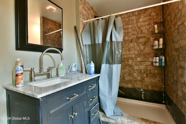 bathroom featuring vanity and a shower with shower curtain