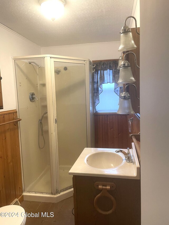 261 Fox Hill Rd, Edinburg, NY 12134 - bathroom featuring a shower stall, tile patterned flooring, a textured ceiling, vanity, and crown molding