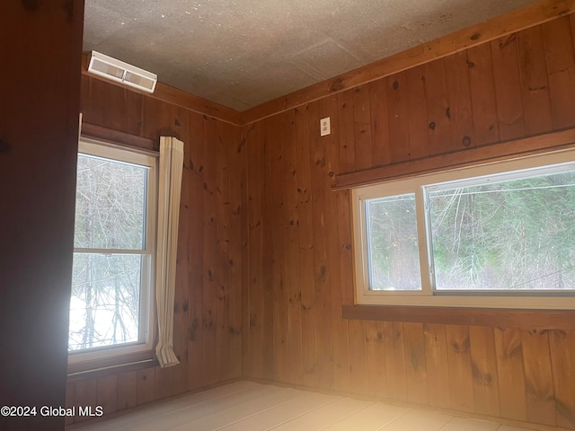 empty room with wood walls