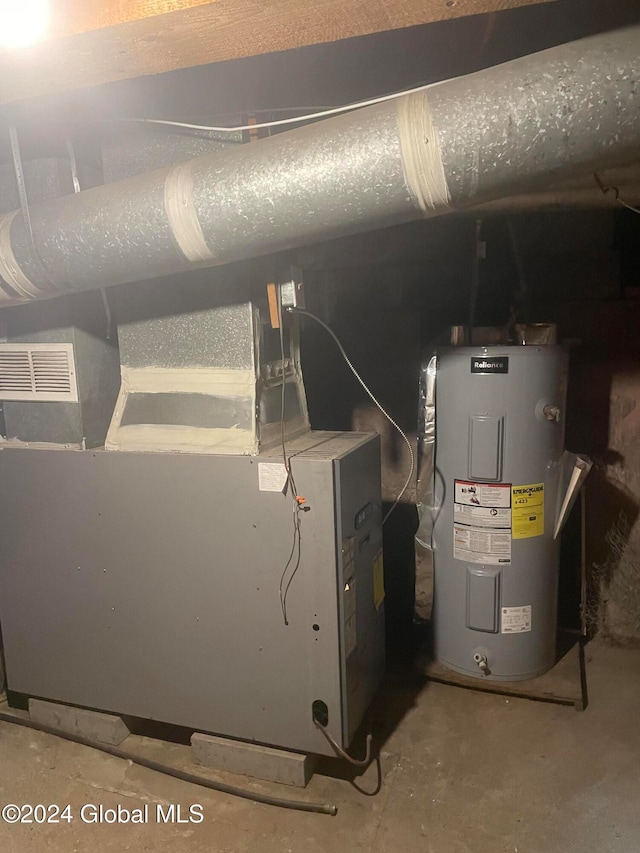 utility room featuring electric water heater