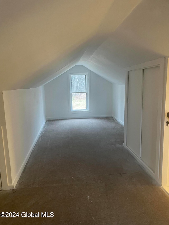 additional living space featuring vaulted ceiling