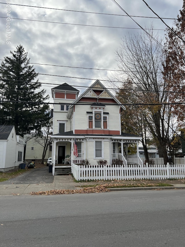 21 Willett St, Fort Plain, NY 13339 - victorian house with covered porch and a fenced front yard