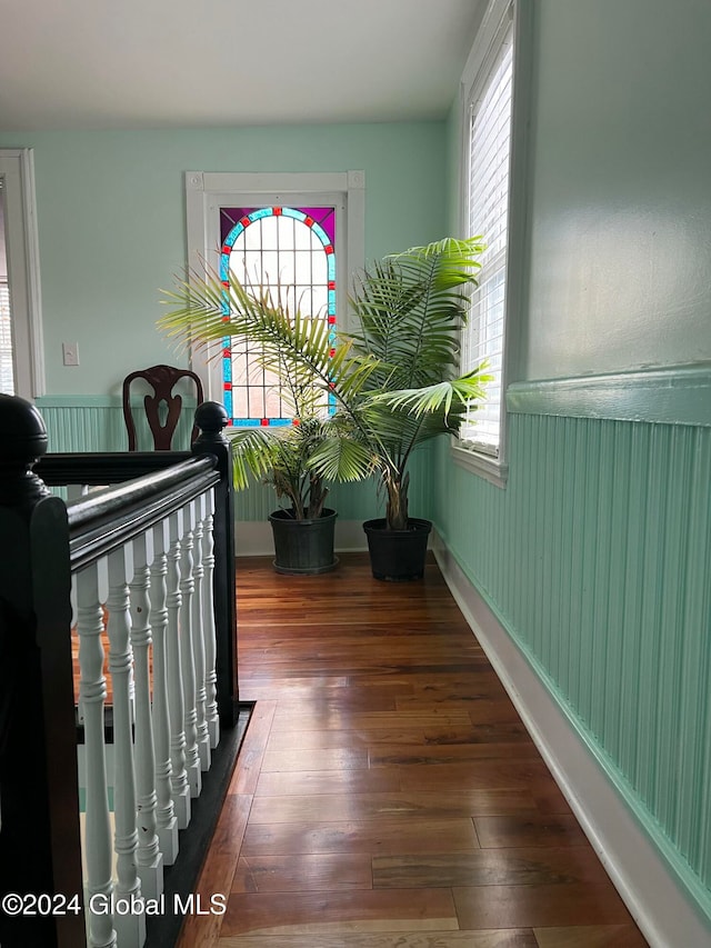 bedroom with dark hardwood / wood-style floors