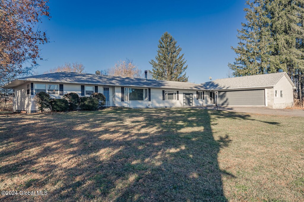 2985 State Highway 67, Fort Johnson, NY 12070 - ranch-style house with a front lawn and a garage