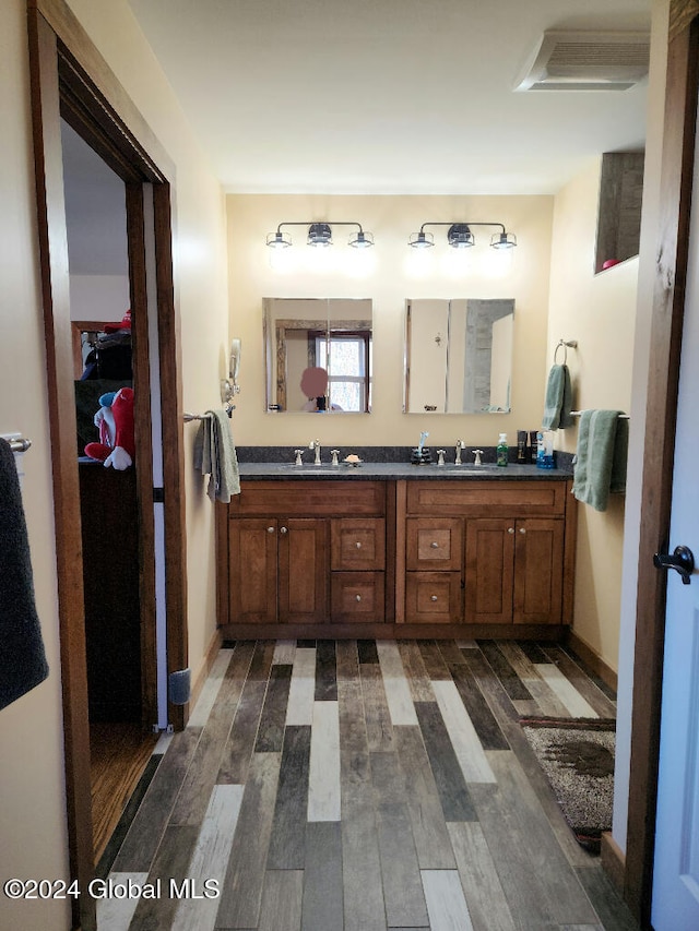 bathroom featuring hardwood / wood-style floors and vanity