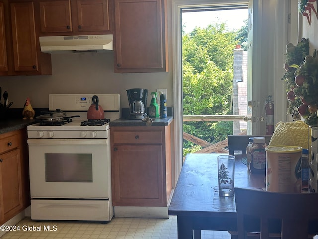 kitchen with white gas range