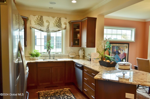 kitchen featuring light stone countertops, sink, dark hardwood / wood-style flooring, kitchen peninsula, and appliances with stainless steel finishes