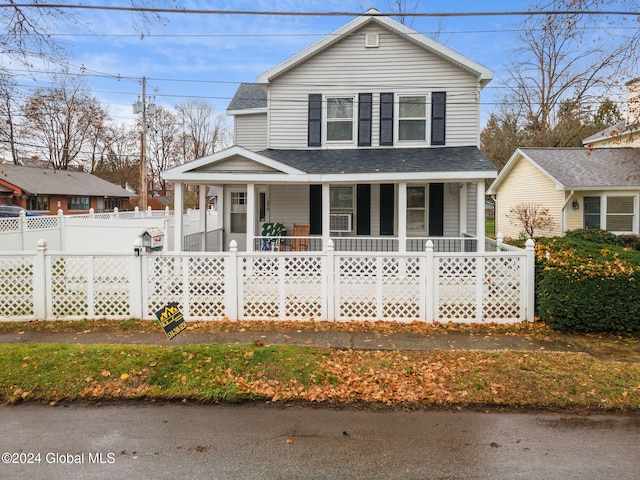 farmhouse featuring covered porch