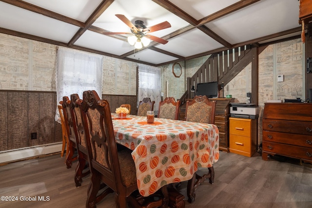 dining area featuring ceiling fan, dark wood-type flooring, and coffered ceiling