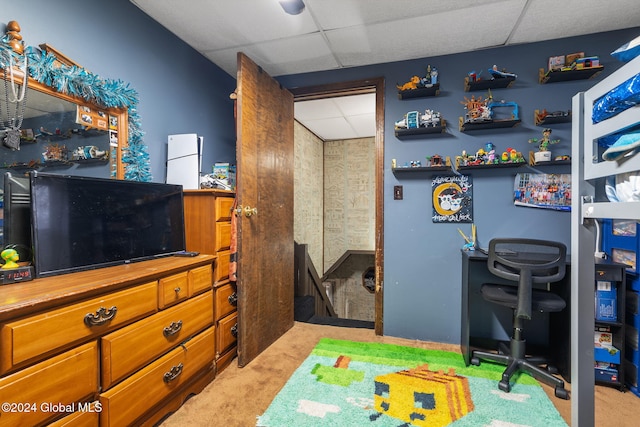 recreation room with light colored carpet and a drop ceiling