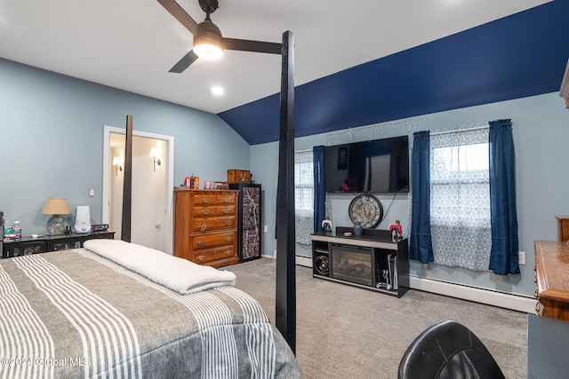 bedroom with light carpet, vaulted ceiling, baseboard heating, and ceiling fan