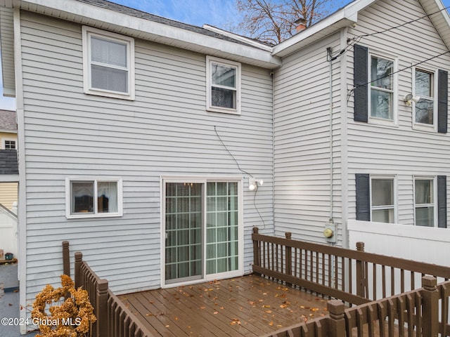 back of house with a wooden deck