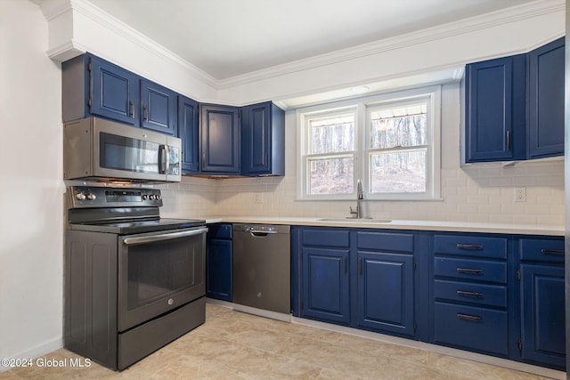 kitchen featuring appliances with stainless steel finishes, backsplash, blue cabinets, and sink