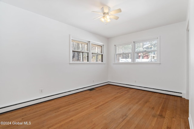 unfurnished room with plenty of natural light, ceiling fan, and light wood-type flooring