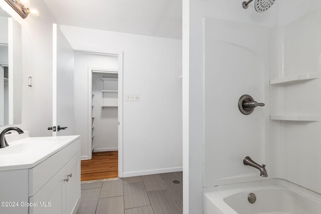 bathroom featuring shower / bathing tub combination and vanity