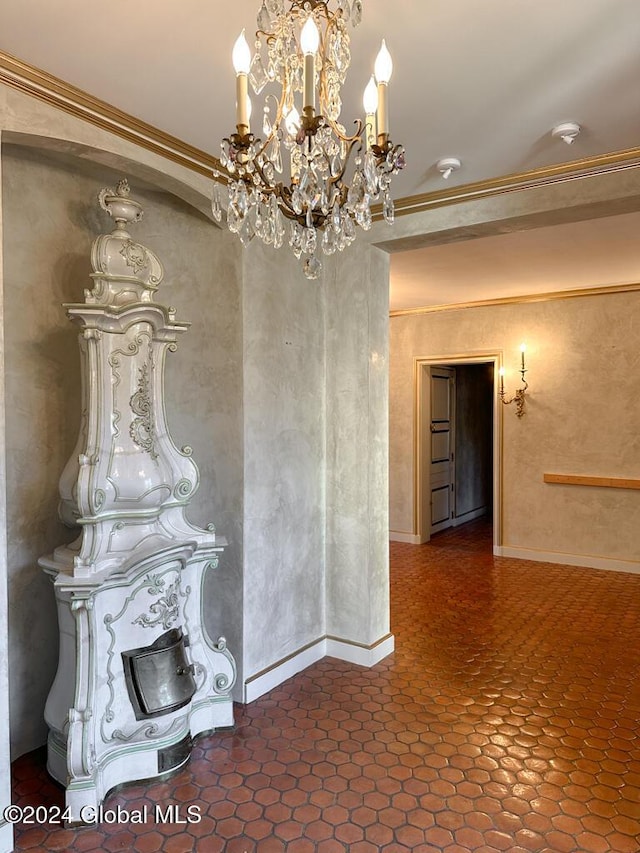 interior space with crown molding and an inviting chandelier