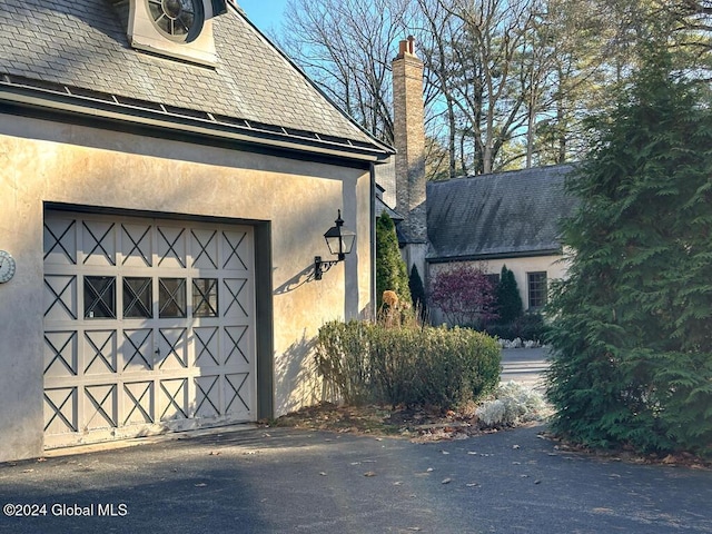 view of side of home with a garage