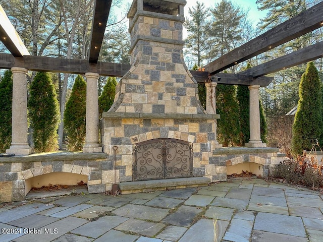 view of patio / terrace with an outdoor stone fireplace