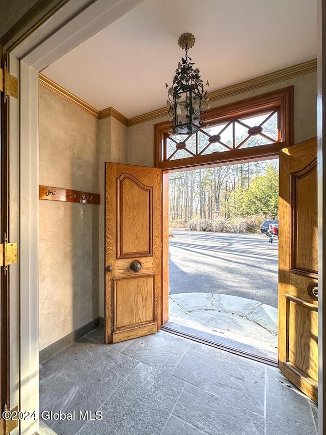 foyer entrance with ornamental molding