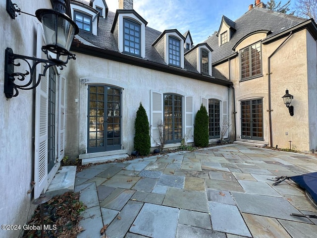 back of house with a patio area