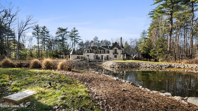 rear view of house with a water view