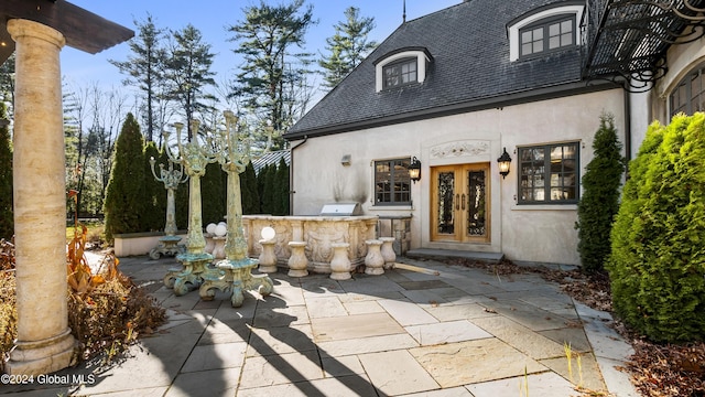 view of patio featuring area for grilling, an outdoor bar, and grilling area