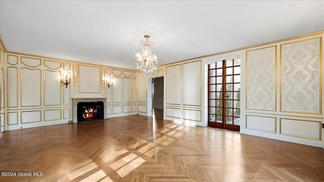 unfurnished living room with an inviting chandelier and light parquet floors