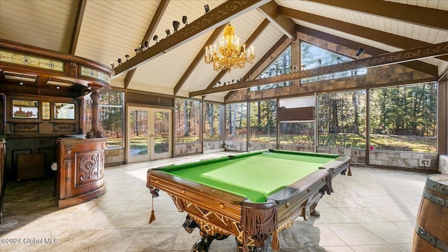 recreation room featuring beam ceiling, high vaulted ceiling, plenty of natural light, and a notable chandelier