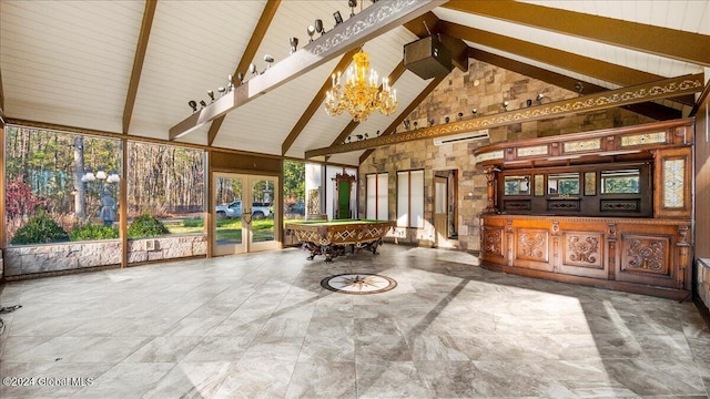 unfurnished sunroom with a chandelier, french doors, lofted ceiling with beams, and billiards