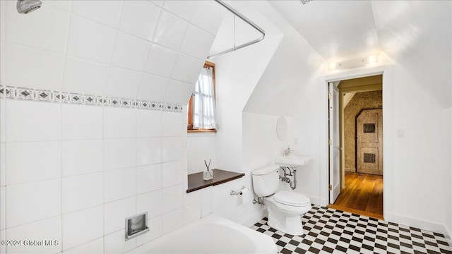 bathroom featuring hardwood / wood-style floors, shower / bath combination, and toilet