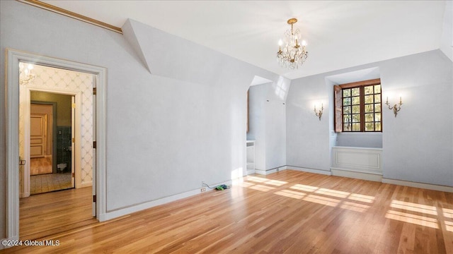 interior space with a chandelier and light hardwood / wood-style flooring