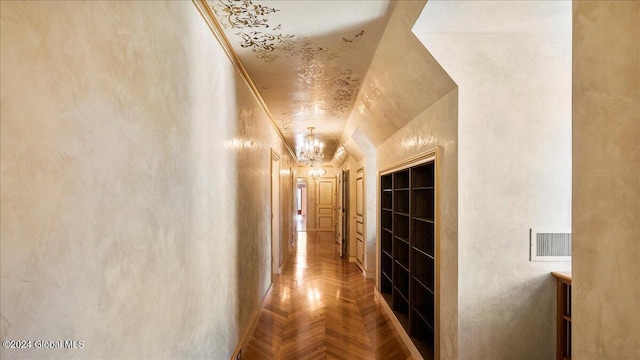 corridor featuring parquet floors and a chandelier