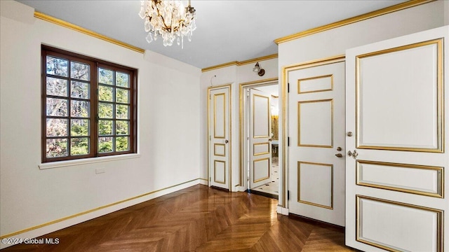 interior space featuring a notable chandelier, dark parquet flooring, and crown molding