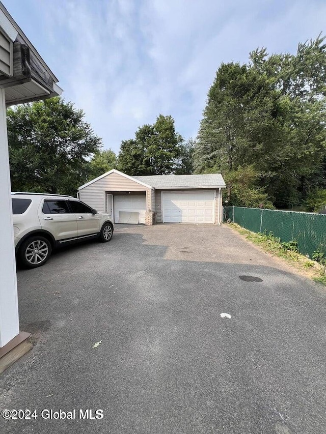 view of home's exterior featuring an outbuilding and a garage