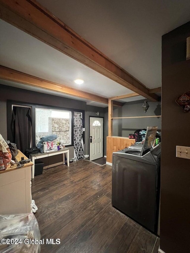 living room with beam ceiling, dark hardwood / wood-style floors, and independent washer and dryer