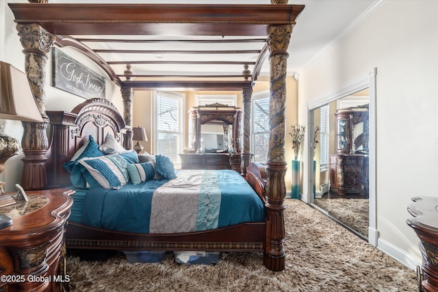 carpeted bedroom featuring beamed ceiling and ornamental molding