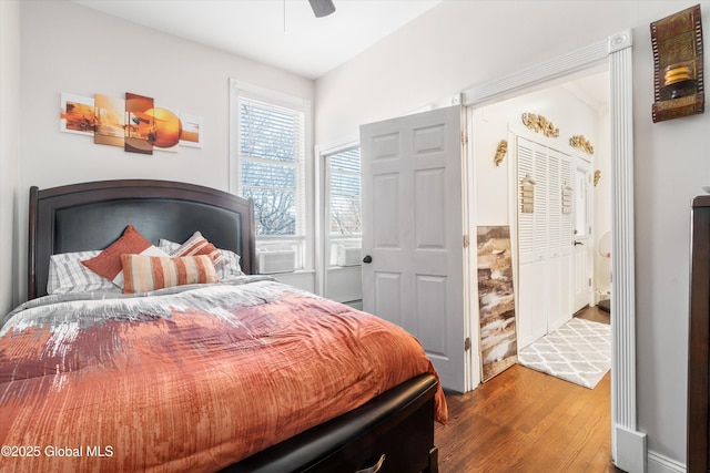 bedroom featuring hardwood / wood-style flooring and ceiling fan