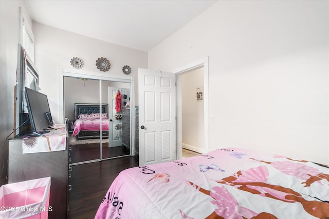 bedroom with hardwood / wood-style floors and a closet