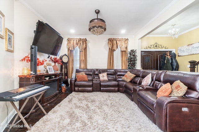 living room with crown molding, dark hardwood / wood-style floors, and a chandelier