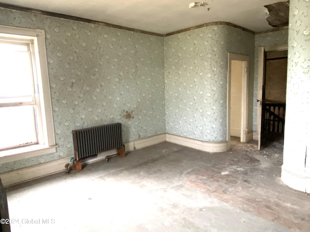 unfurnished room featuring radiator