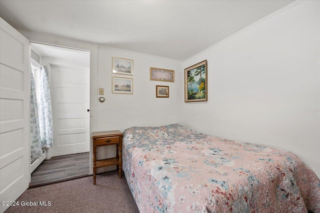 carpeted bedroom with ornamental molding