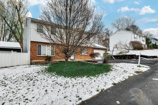 view of front of house with a lawn and a garage