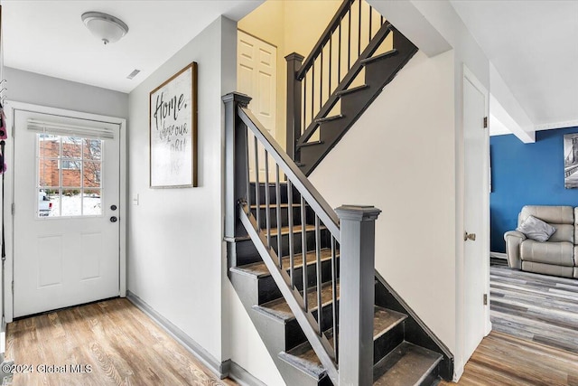 entryway with hardwood / wood-style flooring