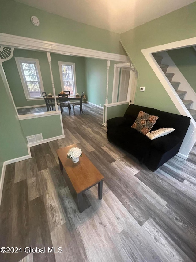 living room with dark hardwood / wood-style floors