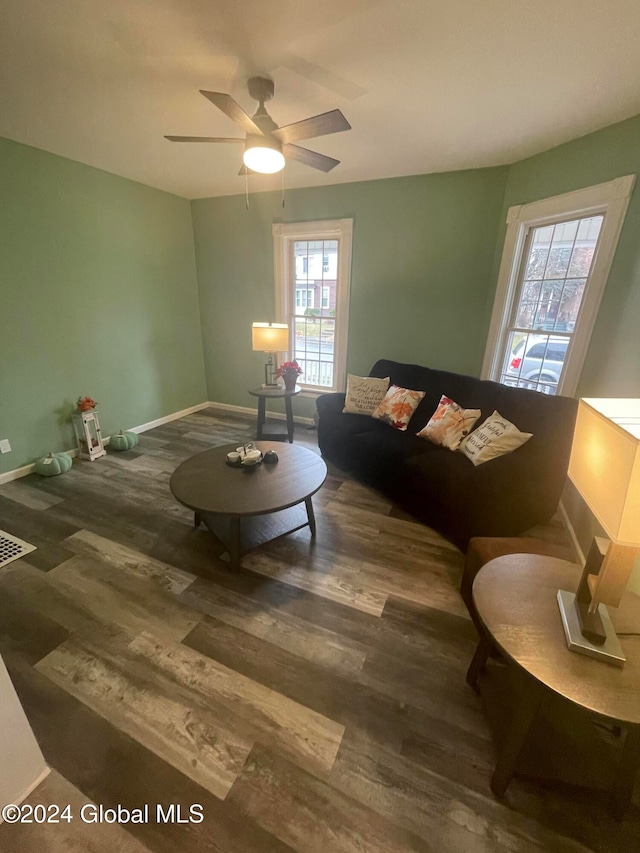 living room with a healthy amount of sunlight, ceiling fan, and wood-type flooring